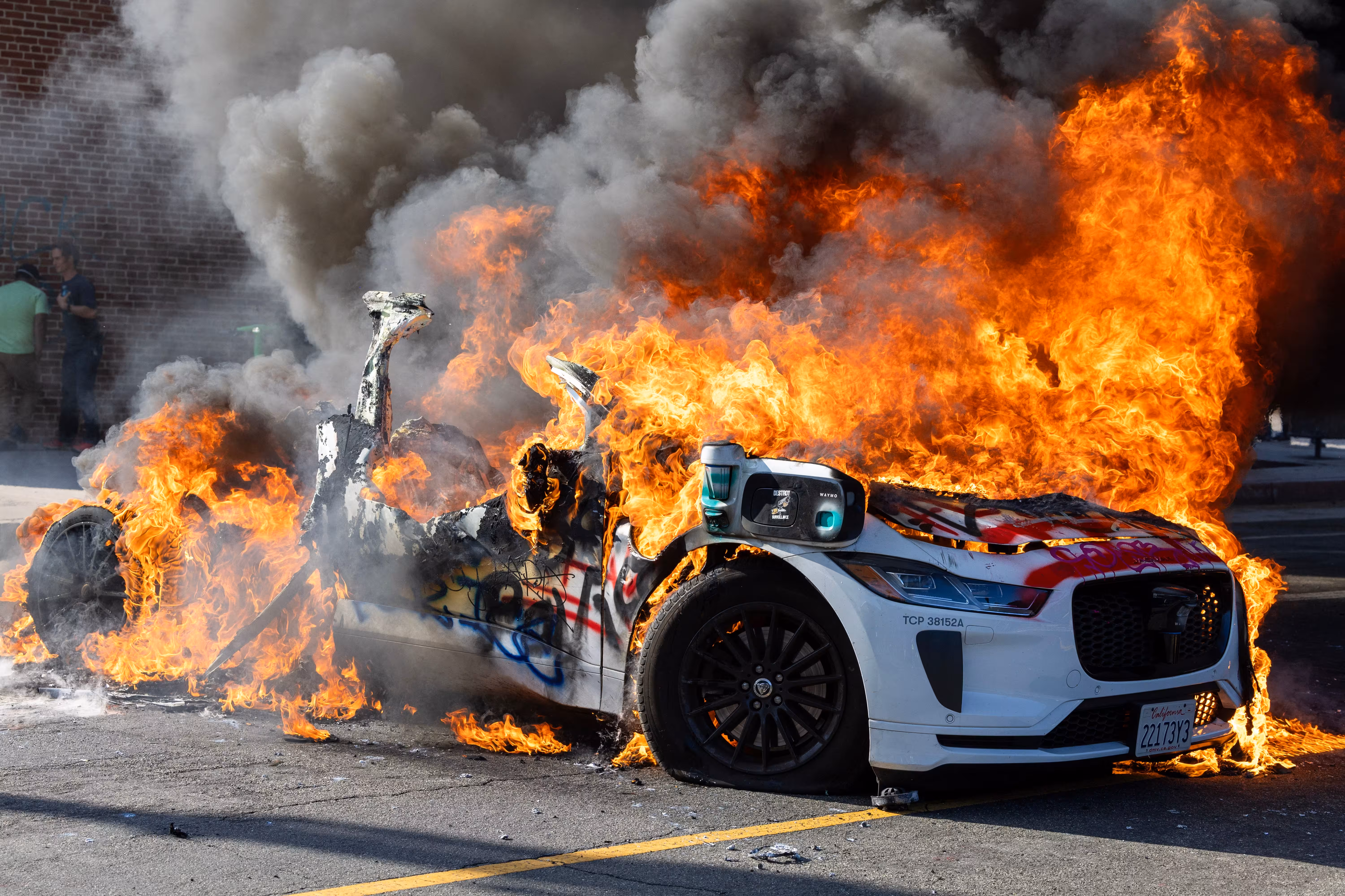 84113539007-waymo-fire-la-ice-protes